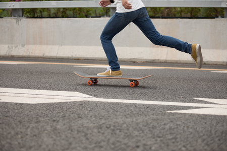 Skateboarder sakteboarding on highwayの写真素材