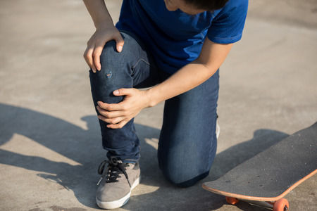 skateboarder got spirts injury skateboarding on skateparkの写真素材