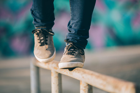 Legs walking on steel pipe with balance