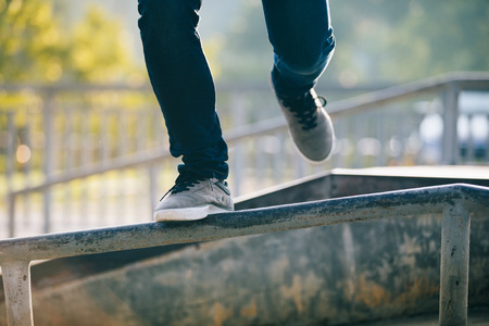 Legs walking on steel pipe with balanceの写真素材