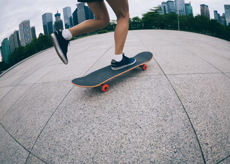 skateboarder riding skateboard on urban cityの写真素材