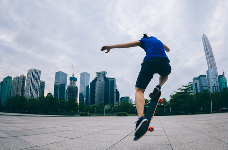 skateboarder riding skateboard on urban cityの写真素材