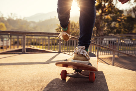 Skateboarder skateboarding at skatepark ramp