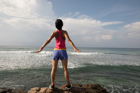 Successful woman enjoy the peace and relax on seasideの写真素材