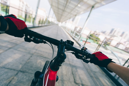 Riding bike on overpass in city