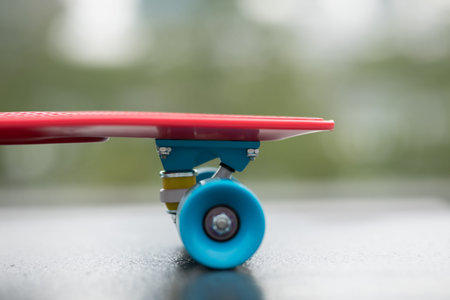 Red skateboard ready for riding at city