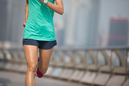 Healthy lifestyle woman runner running at Hong kongの写真素材