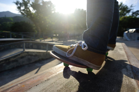 Skateboarder skateboarding on skate park