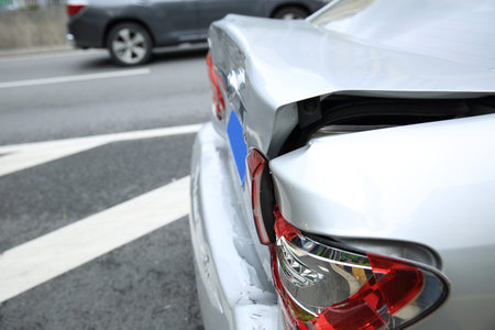 Car crash accident on street, damaged automobiles after collision in city