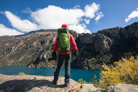 Woman backpacker hiking in beautiful winter mountainsの写真素材