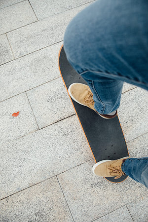 Skateboarder legs skateboarding at outdoors