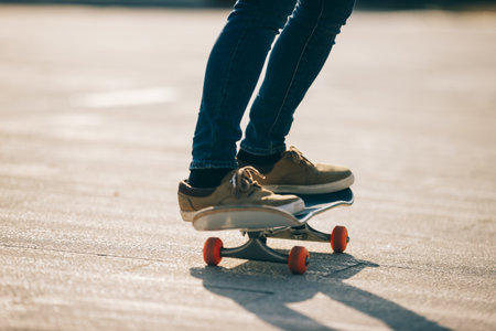 Skateboarder skateboarding outdoors on sunny morningの写真素材
