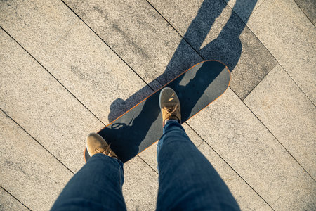 Skateboarder skateboarding outdoors on sunny morning