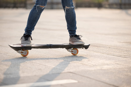 Skateboarder legs skateboarding at outdoors