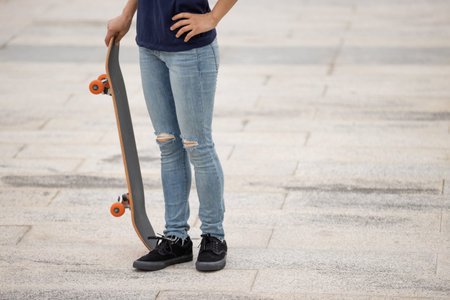 Skateboarder legs skateboarding at outdoors
