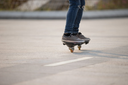 Skateboarder legs skateboarding at outdoors