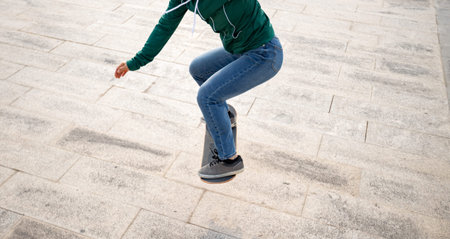 Woman skateboarder skateboarding at outdoors