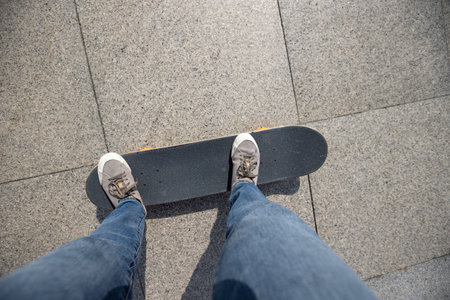 Skateboarder skateboarding at sunrise city
