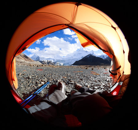 Two hikers enjoy the beautiful landscape in tent