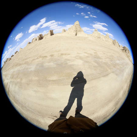 Photographer taking photo in desertの写真素材