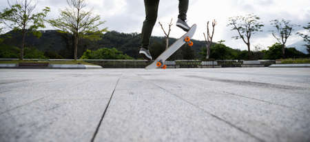 Skateboarder skateboarding outdoors in the morningの写真素材