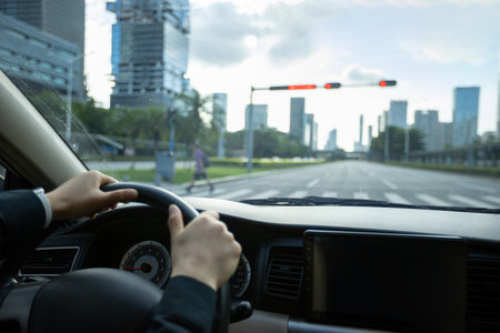 Driving car in modern cityの写真素材