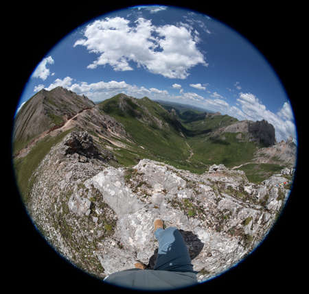 Hiker on high altitude mountain top enjoy the viewの写真素材