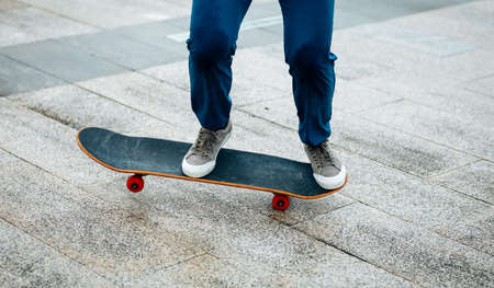 Skateboarder skateboarding outdoors in cityの写真素材