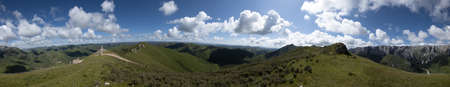 Panorama view high altitude mountain landscape under blue skyの写真素材
