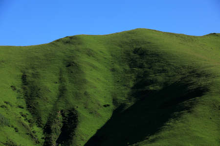 High altitude grassland mountain landscapeの写真素材