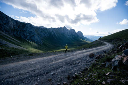 Woman runner running at mountain topの写真素材