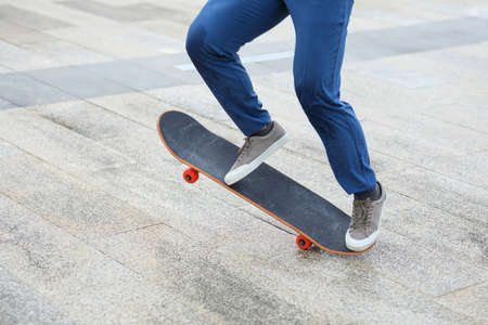 Skateboarder skateboarding outdoors in cityの写真素材
