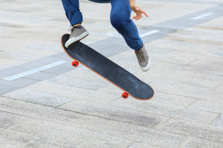 Skateboarder skateboarding outdoors in cityの写真素材