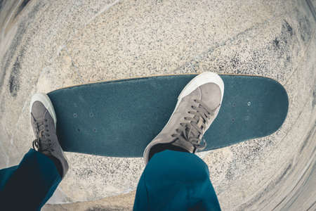 Skateboarder riding on skateboard outdoors in cityの写真素材