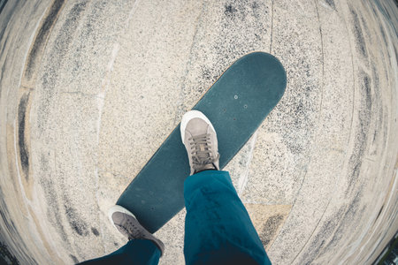 Skateboarder riding on skateboard outdoors in cityの写真素材