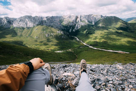 Hiker on high altitude mountain top enjoy the viewの写真素材