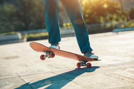 Skateboarder skateboarding outdoors in cityの写真素材