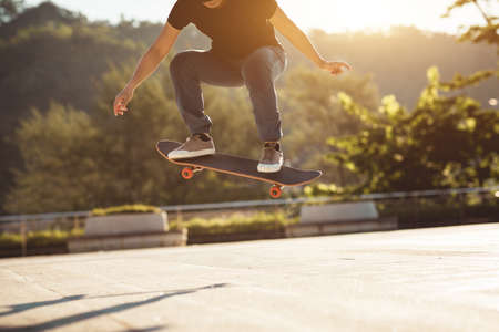 Skateboarder skateboarding outdoors in cityの写真素材