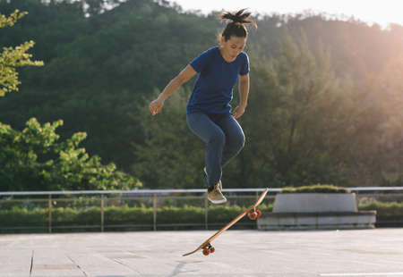 Skateboarder skateboarding outdoors in cityの写真素材