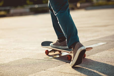 Skateboarder skateboarding outdoors in cityの写真素材