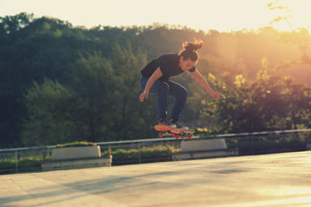 Skateboarder skateboarding outdoors in cityの写真素材