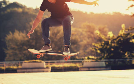 Skateboarder skateboarding outdoors in cityの写真素材