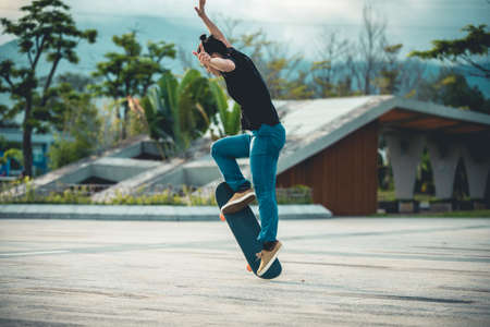 Skateboarder skateboarding outdoors in cityの写真素材
