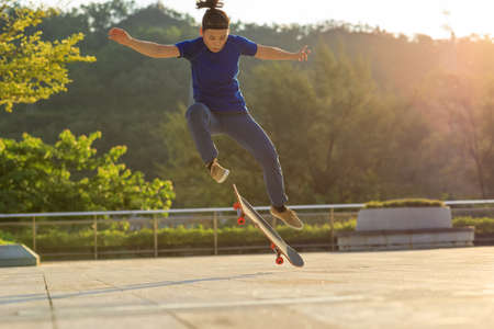 Skateboarder skateboarding outdoors in cityの写真素材