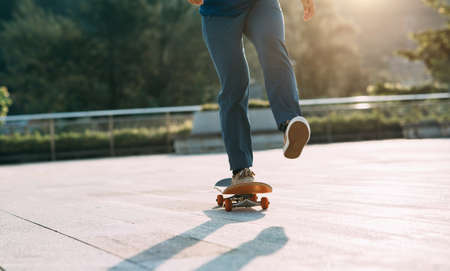 Skateboarder skateboarding outdoors in cityの写真素材