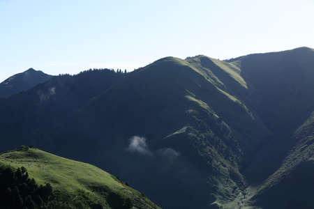 Arising fog nature mist mountains magic high altitude sunrise landscapeの写真素材