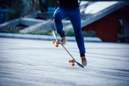 Skateboarder skateboarding outdoors in cityの写真素材