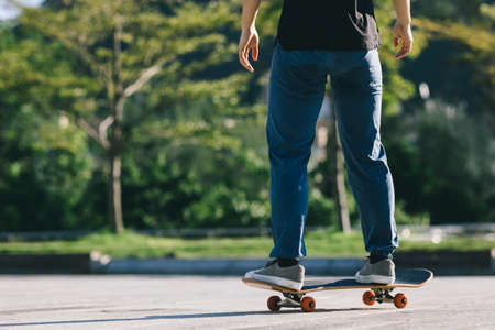 Skateboarder skateboarding outdoors in cityの写真素材