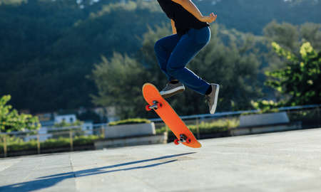 Skateboarder skateboarding outdoors in cityの写真素材