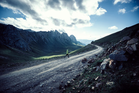 Woman trail runner running on mountain topの写真素材